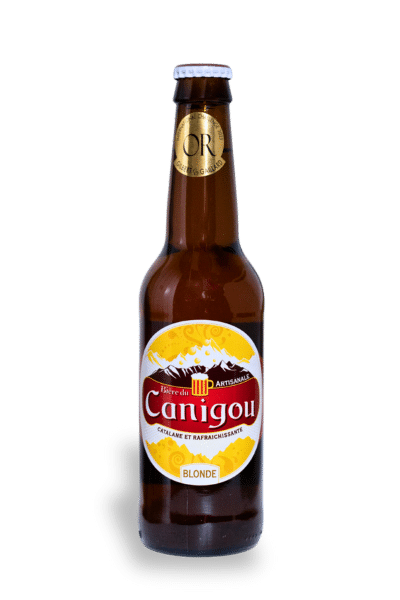 Bière blonde du Canigou étiquette or et capsule primée, mettant en valeur sa qualité artisanale.
