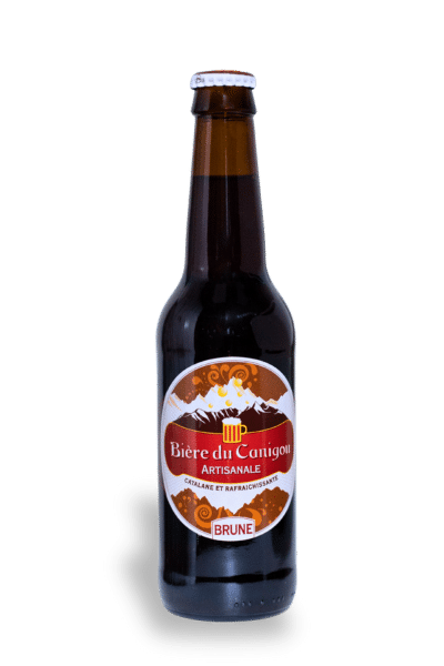 Bouteille brune de Bière du Canigou Brune, avec logo montagne, étiquette rouge et blanche.