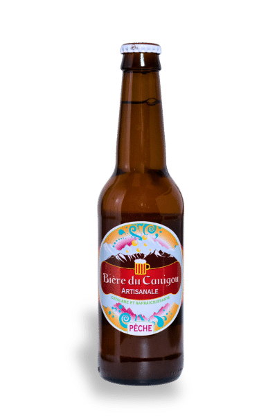 Bouteille Bière du Canigou goût pêche, étiquette colorée.